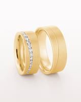 YELLOW GOLD FLAT WEDDING RING WITH CURVED LINE OF TAPERED DIAMONDS 7.5MM - RING ON LEFT