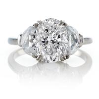 OVAL DIAMOND RING WITH SIDE ACCENT STONES