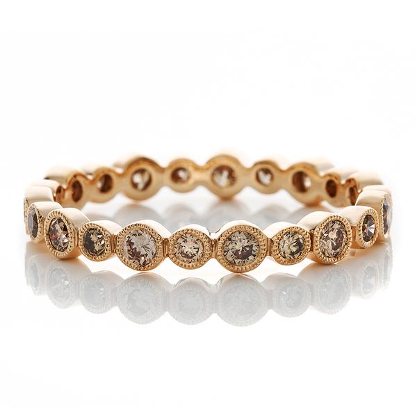 ROSE GOLD LARGE AND SMALL BEZELS HOLD CHAMPAGNE DIAMONDS