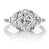 OVAL CENTER  DIAMOND FLANKED BY HALF MOONS - CUSTOM MADE RING MOUNTING