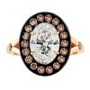 OVAL DIAMOND SURROUNDED BY BLACK HALO SET WITH CHAMPAGNE DIAMONDS